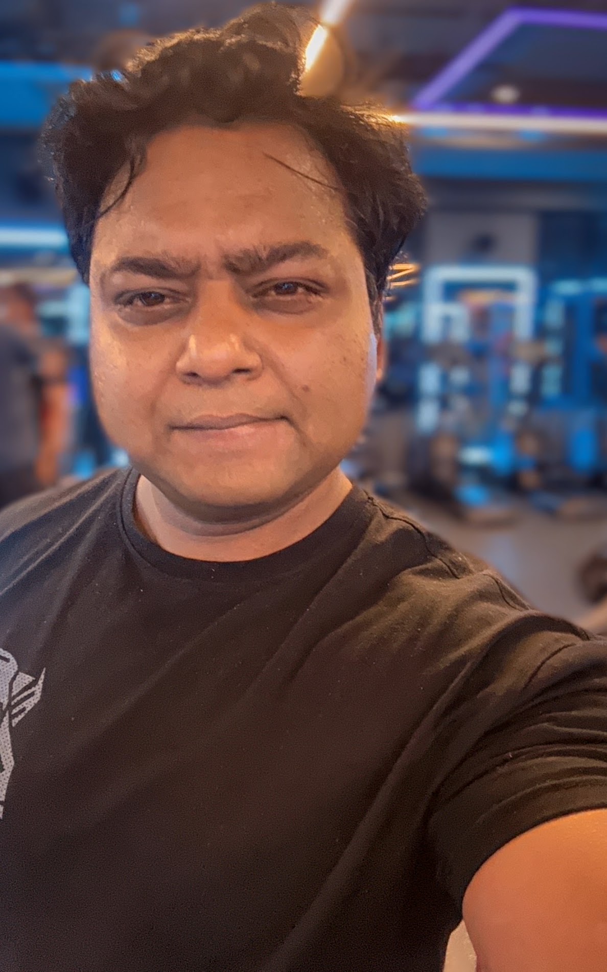 An authentic close portrait of Suchay in a dark T-shirt